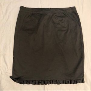 Black trumpet skirt w/ back slit.